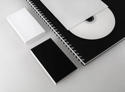 Business cards, compact disc and notepad. Template for branding identity for designers. Shallow depth of field.