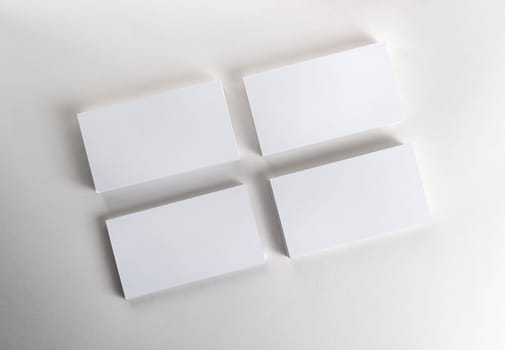 Blank business cards on the table. Template for ID. Top view.