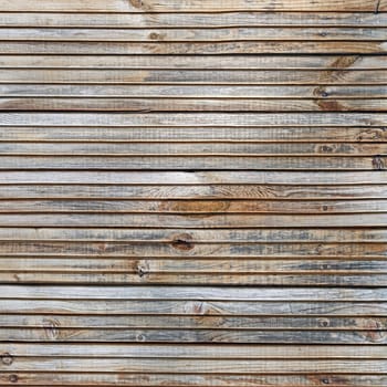 Wood plank texture. Weathered wooden background with knots and nails.