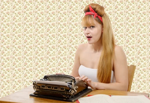 sexy young pinup girl with old typewriter