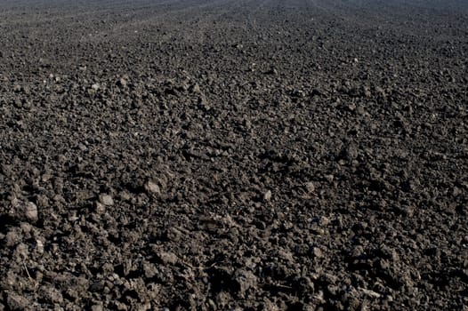 the black plowed field in the fall, a subject seasons and the nature