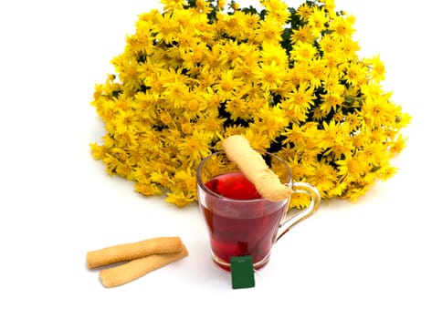 the tea decorated with cookies and a bouquet of yellow flowers on a white background, isolate, a subject fall, food and drinks