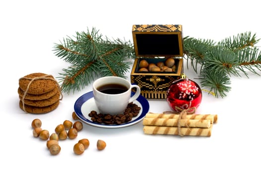 oat baking, a fir-tree branch with ornament, a trunk, sweets and nutlets, the subject Christmas and New Year