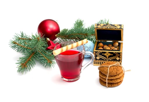 tea, coniferous branch with New Year's scenery and a casket with nuts, a still life, the subject Christmas and New Year