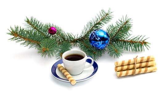 fir-tree branch with ornament, a cup of coffee and a linking of cookies, the subject Christmas and New Year