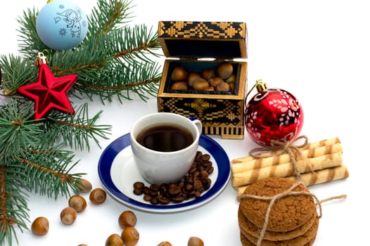 fir-tree branch with ornament, a trunk, sweets and nutlets, the subject Christmas and New Year