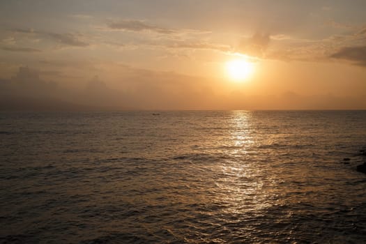 The reflection of the sun in the sea at dawn