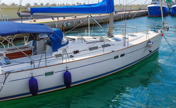 Close-up fragment of modern luxury yacht in the harbor.