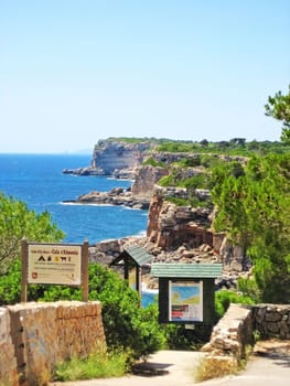 Cala Llombards, Majorca, Spain - June 22, 2008: Cala s'Almonia / Calo d'Es Moro - entrance with signposts of the two famous beaches in the south of the island
