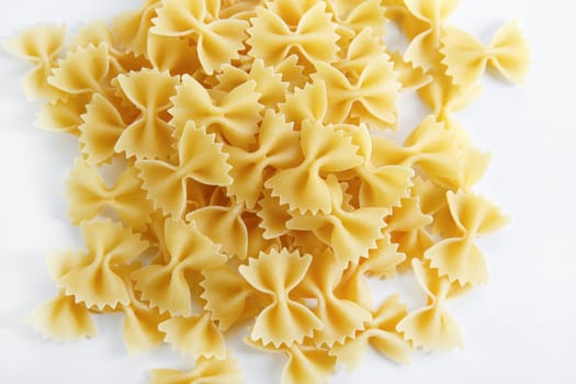 Uncooked italian bow tie pasta. Farfalle pasta.