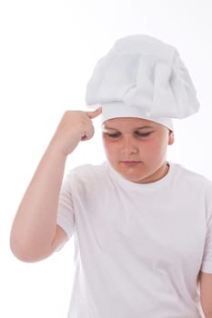One little boy as chef cook making salad, cooking with vegetables. Isolated on white.
