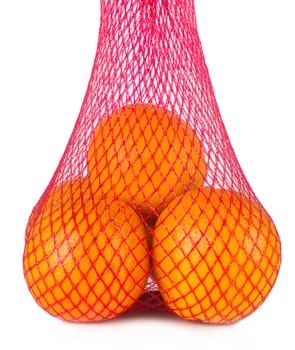 Pack of four oranges in a nylon bag isolated on white background