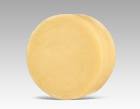 Round yellow cheese mockup with no label on grey background