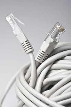 Vertical side view of two grey network cable sockets
