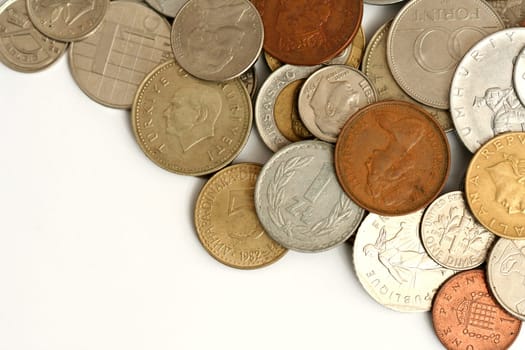 Coins of different currency on white background