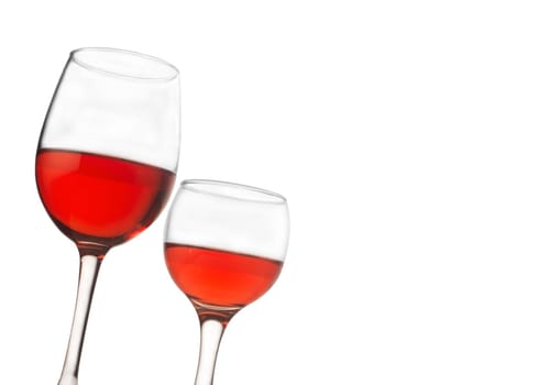 Horizontal front view of two rose wine glasses isolated on white background