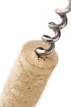 A metal screw in a wine cork isolated on white background