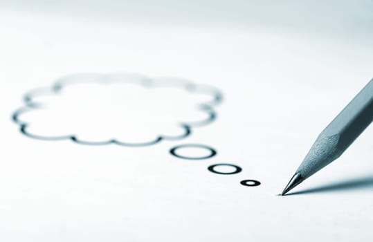 Horizontal close up of a sharp pen with a speech bubble coming out of its top