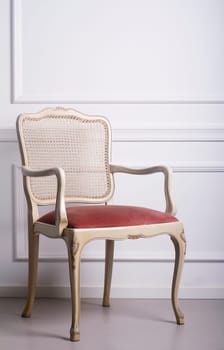 Vintage wooden chair against a white elegant interior wall