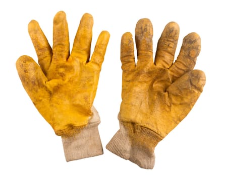 Used pair of gardening yellow gloves isolated on white background