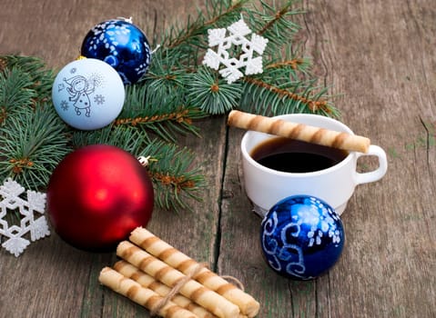 the fir-tree branch decorated with spheres and a snowflake coffee and baking, a subject holidays Christmas and New Year
