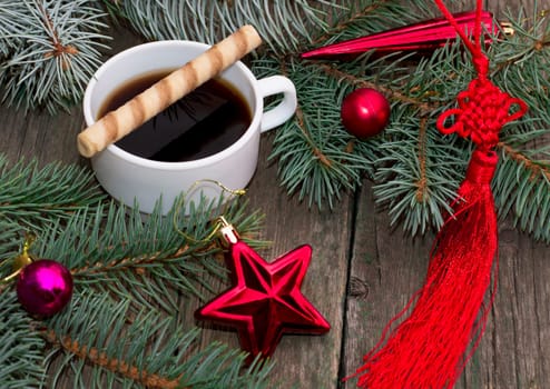 coniferous branch, red star and red tape, still life subject Christmas and New Year