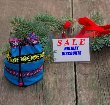 label with an inscription Sale, nearby a bag with gifts, the subject Christmas and New Year