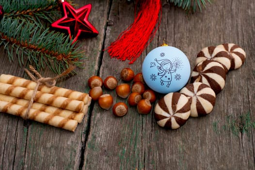 the forest nutlets and baking decorated with a coniferous branch a still life, the subject Christmas and New Year
