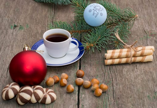 two groups of cookies, coffee, Christmas tree decorations and coniferous branch, still life, subject Christmas and New Year