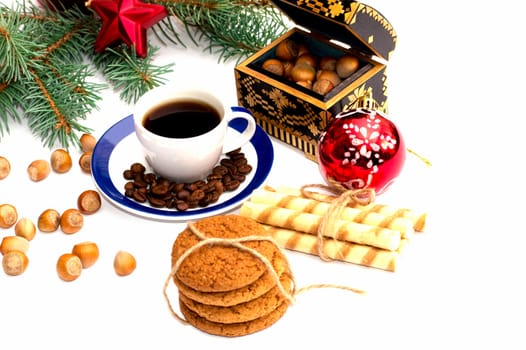 coniferous branch, baking, coffee and nutlets, still life subject Christmas and New Year