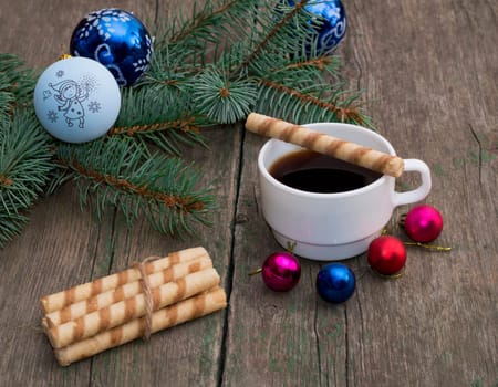 coniferous branch with an ornament, coffee and baking, the subject Christmas and New Year