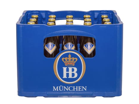 Munich, Germany - June 10, 2016: Isolated on white crate with bottles of classic German traditional Bavarian beer HB Munich