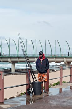 DURBAN, SOUTH AFRICA - JULY 09, 2016: Fisherman at the beach near the Millennium Pier in Umhlanga Rocks