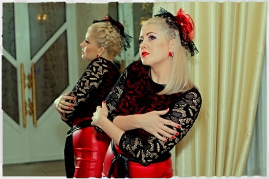 the beautiful woman in a red dress and a red hat at a mirror, a subject beautiful festive women