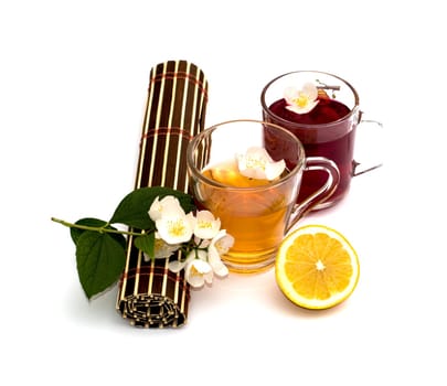 the twisted table rug, the cut lemon and two mugs with drinks, a subject drinks