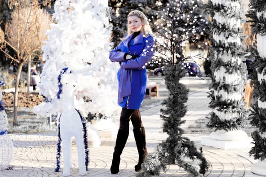 the beautiful woman near a New Year tree, the photo in black-and-white tones, a subject holidays Christmas and New year
