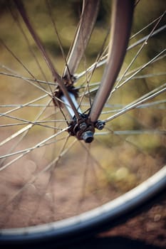 Forward wheel of the bicycle close up with bokeh