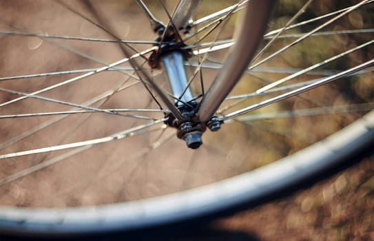 Forward wheel of the bicycle close up with bokeh