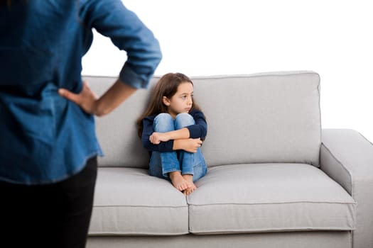 Grown up rebuking a little child for bad behavior