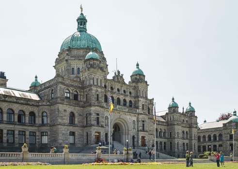 VICTORIA, BRITISH COLUMBIA, CANADA - MAY 19, 2011: People Hanging Out in Front of Canadian Parliament Building in Victoria British Columbia