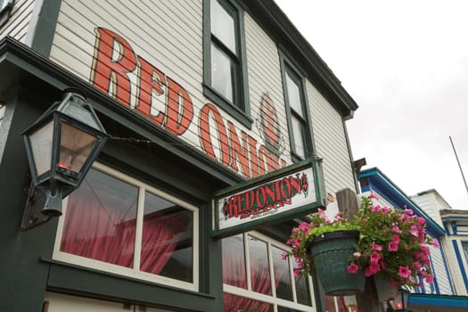 SKAGWAY, ALASKA, USA - SEPTEMBER 20, 2011: The Red Onion Saloon is Open to Cruise Ship Tourists. This Historic Saloon Opened in 1898 as a Bar and Brothel Catering to Gold Rush Miners.