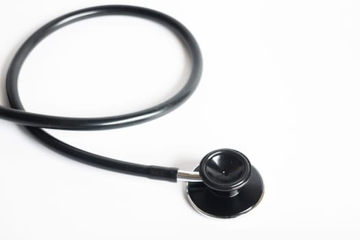 Black stethoscope on white background, stock photo