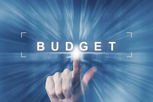 hand clicking on budget button with zoom effect background