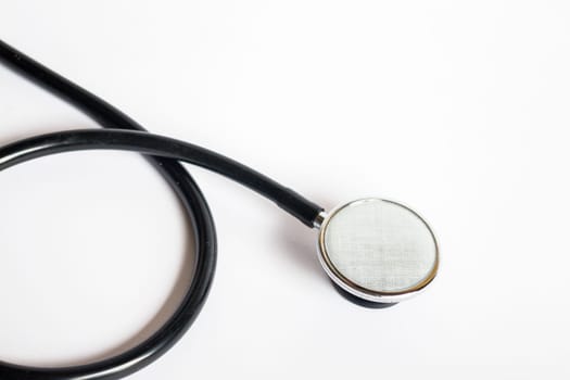 Black stethoscope on white background, stock photo