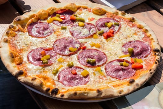 Pizza salami with pepperoni,peppers and cheese.