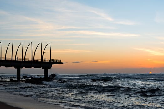 View of the Indian Ocean through the Millennium Pier in Umhlanga Rocks at Sunrise