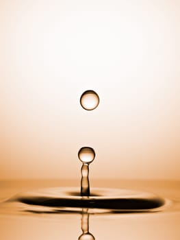 Water Drops Captured before Collision. Macro, Golden backround