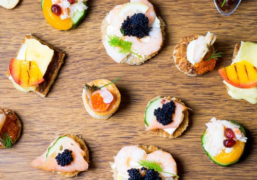Exquisite selection of luxury canapes, appetizer ready to be served for events, celebrations or other occasion