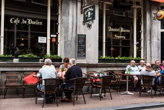 AMSTERDAM, NETHERLANDS, JULLY 9  2016.cafe de doelen in typical district of Amesterdam with people sitting on a terrace, NETHERLANDS