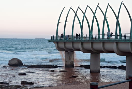 DURBAN, SOUTH AFRICA - JULY 11, 2016: People on the Millennium Pier at the beach in Umhlanga Rocks